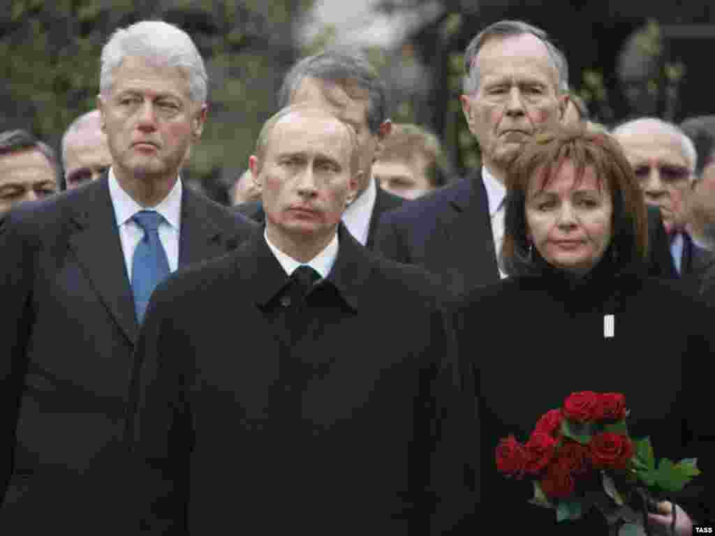 Russian President Vladimir Putin and his wife, Lyudmila, attend the funeral of Boris Yeltsin along with former U.S. Presidents Bill Clinton (left) and George Bush in Moscow in April 2007.