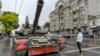 Wagner mercenaries sit atop a tank outside the headquarters of the Southern Military District in Rostov-on-Don, Russia, on June 24. Earlier, Wagner chief Yevgeny Prigozhin said his forces were making a "march of justice" to Moscow.